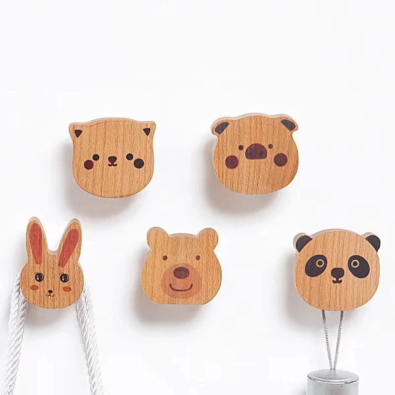 Set of five animal face wooden wall hooks including kitten, bear, panda, piglet, and rabbit.