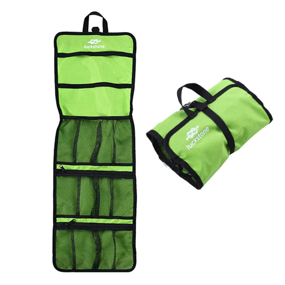 Green climbing gear organizer bag open and rolled, with mesh pockets for small item storage