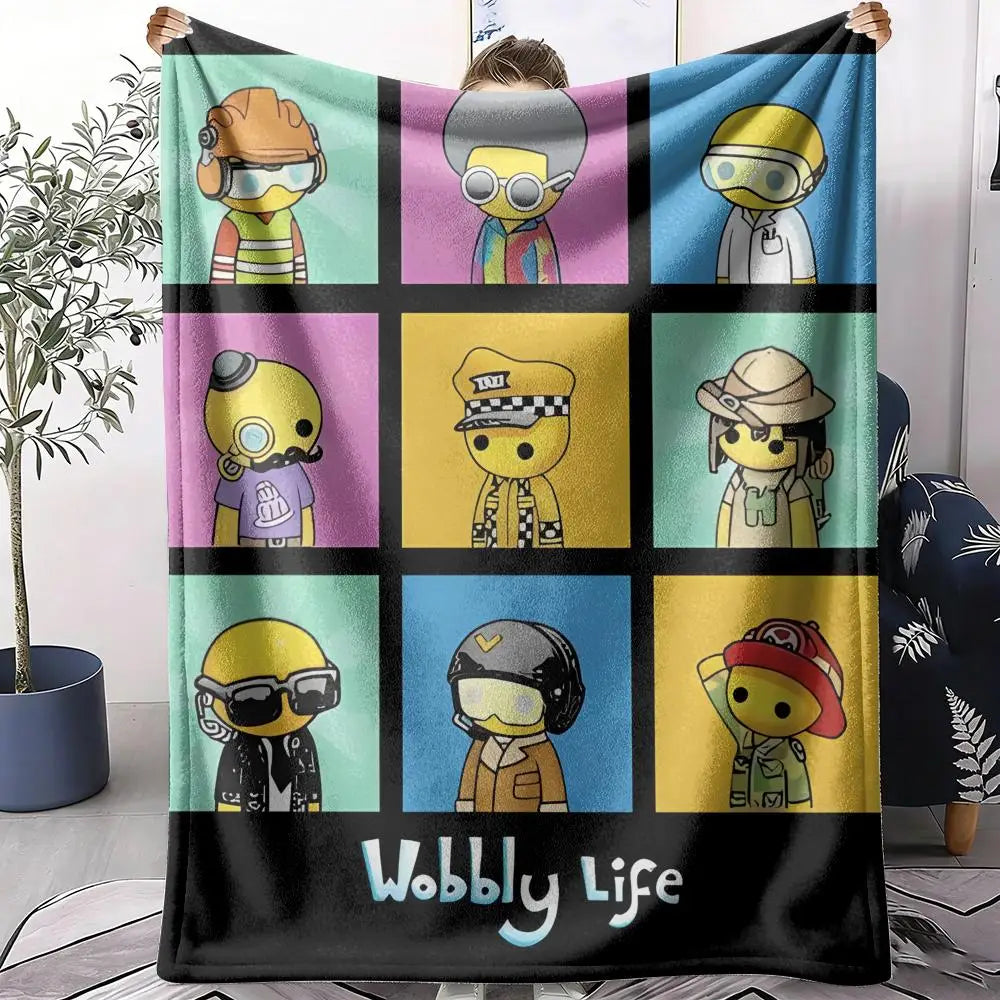 Wobbly Life cartoon print flannel throw blanket shown being held up with nine colorful character panels