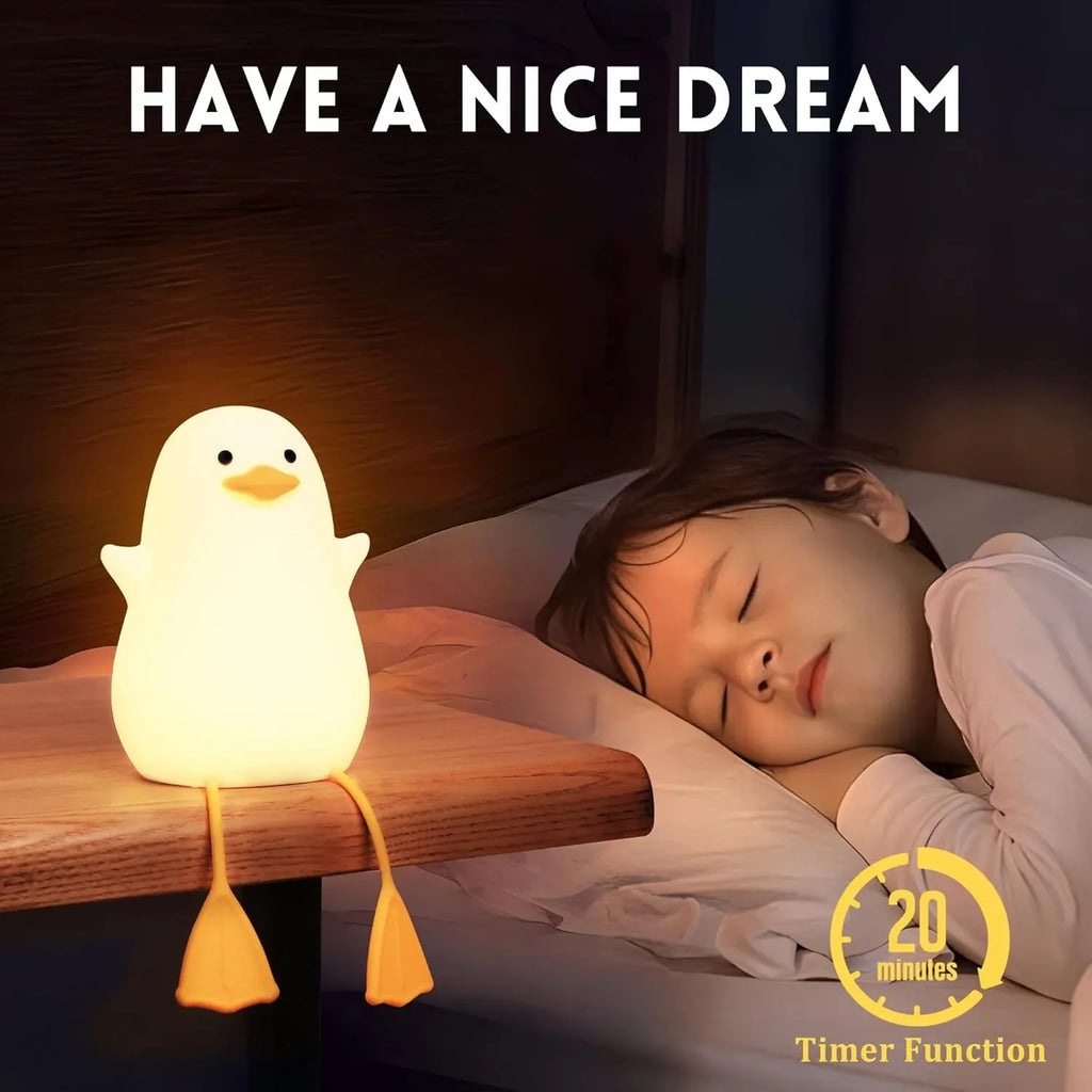 Duck night light on a bedside table next to a sleeping child, reading timer icon visible