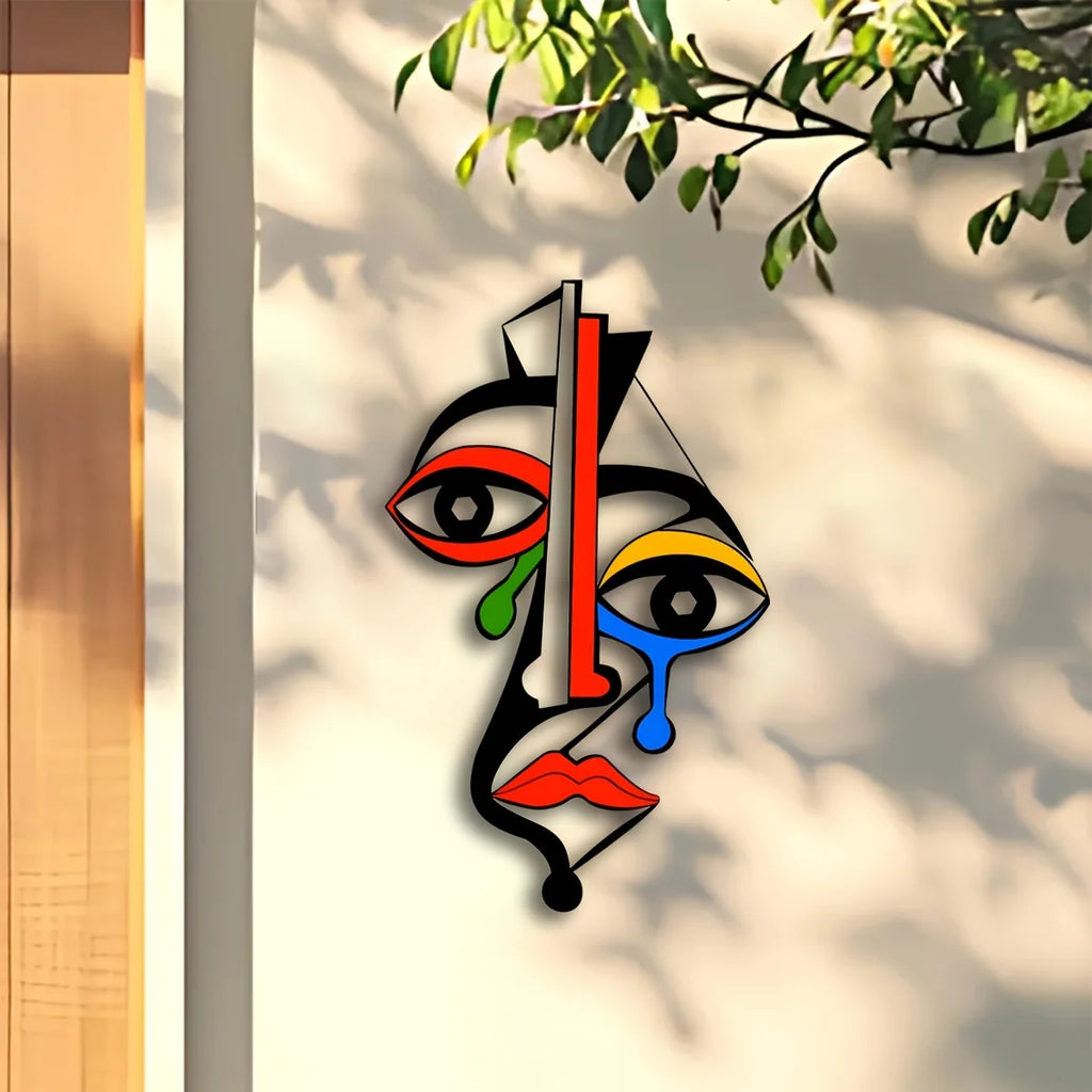 Modern geometric metal face wall art sculpture with bold colors in a bright indoor setting
