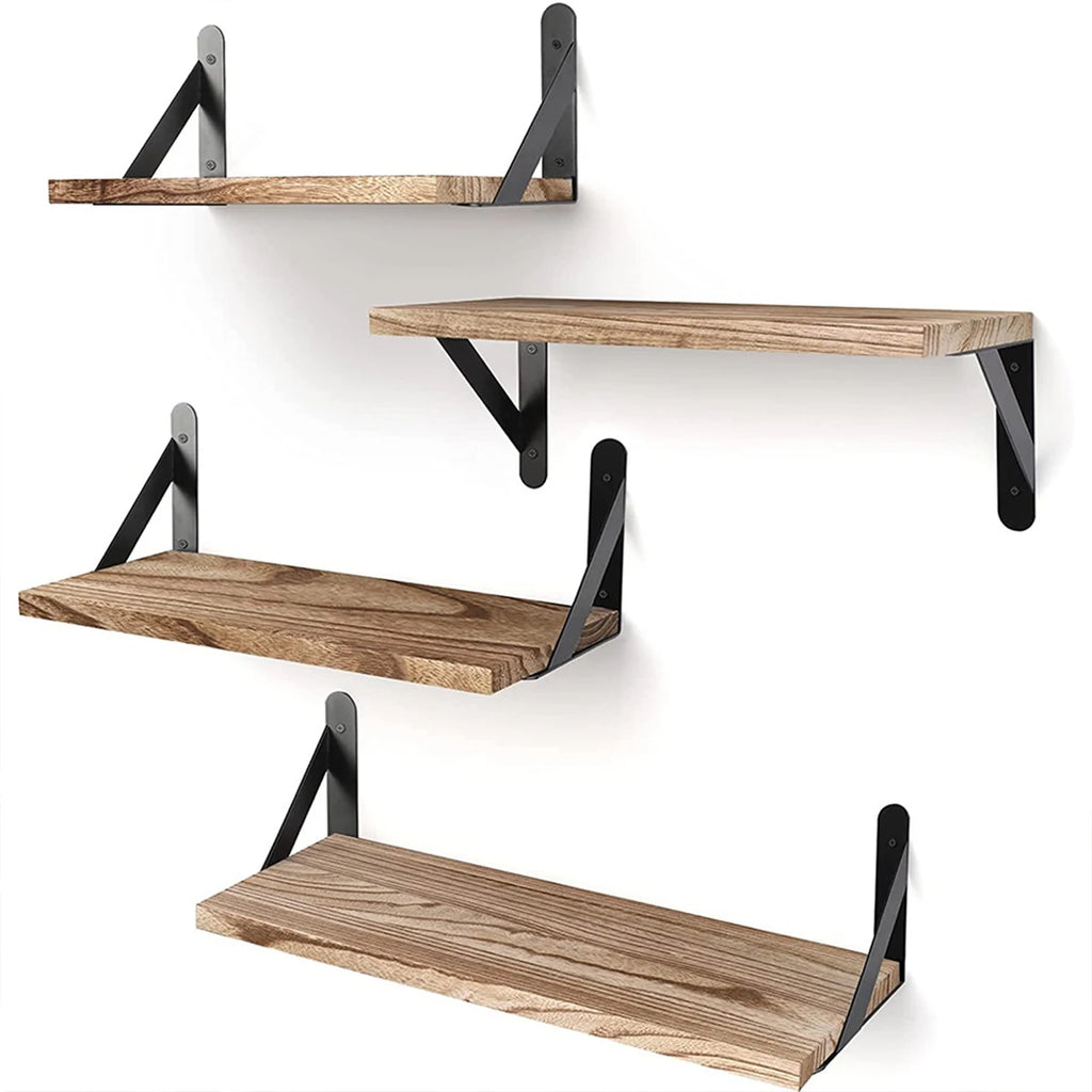 Set of four wall-mounted wooden floating shelves with black brackets installed on a white wall