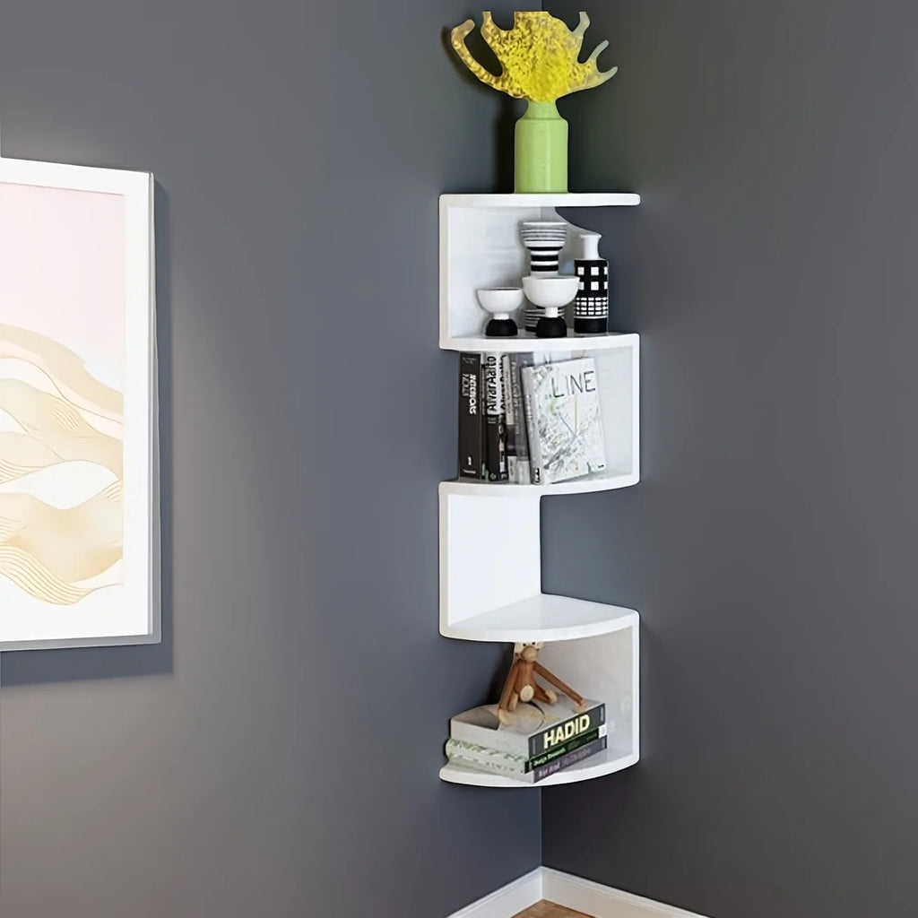 white zigzag corner wall shelf set up in a living room with books and decorative vases