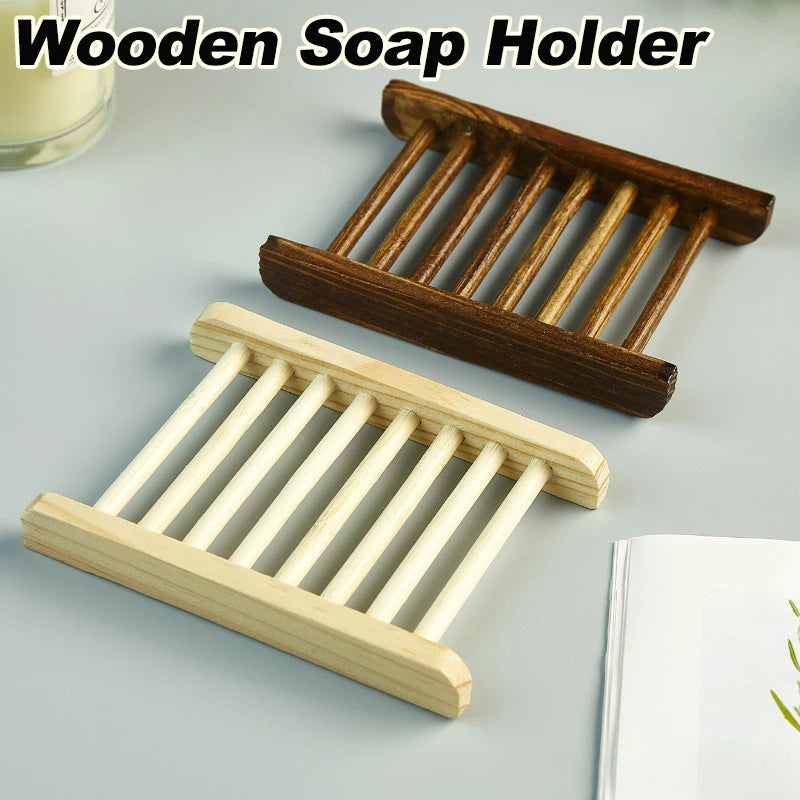 Two wooden soap dishes in light and dark finishes on a countertop