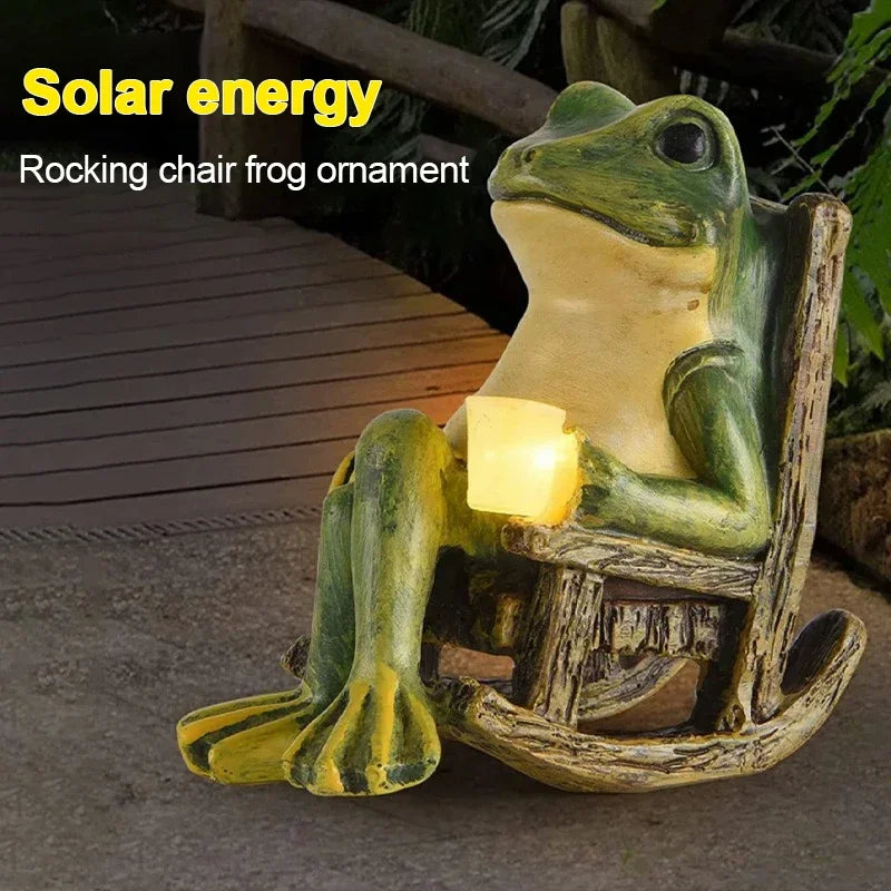 rocking chair frog solar garden light glowing at night on patio