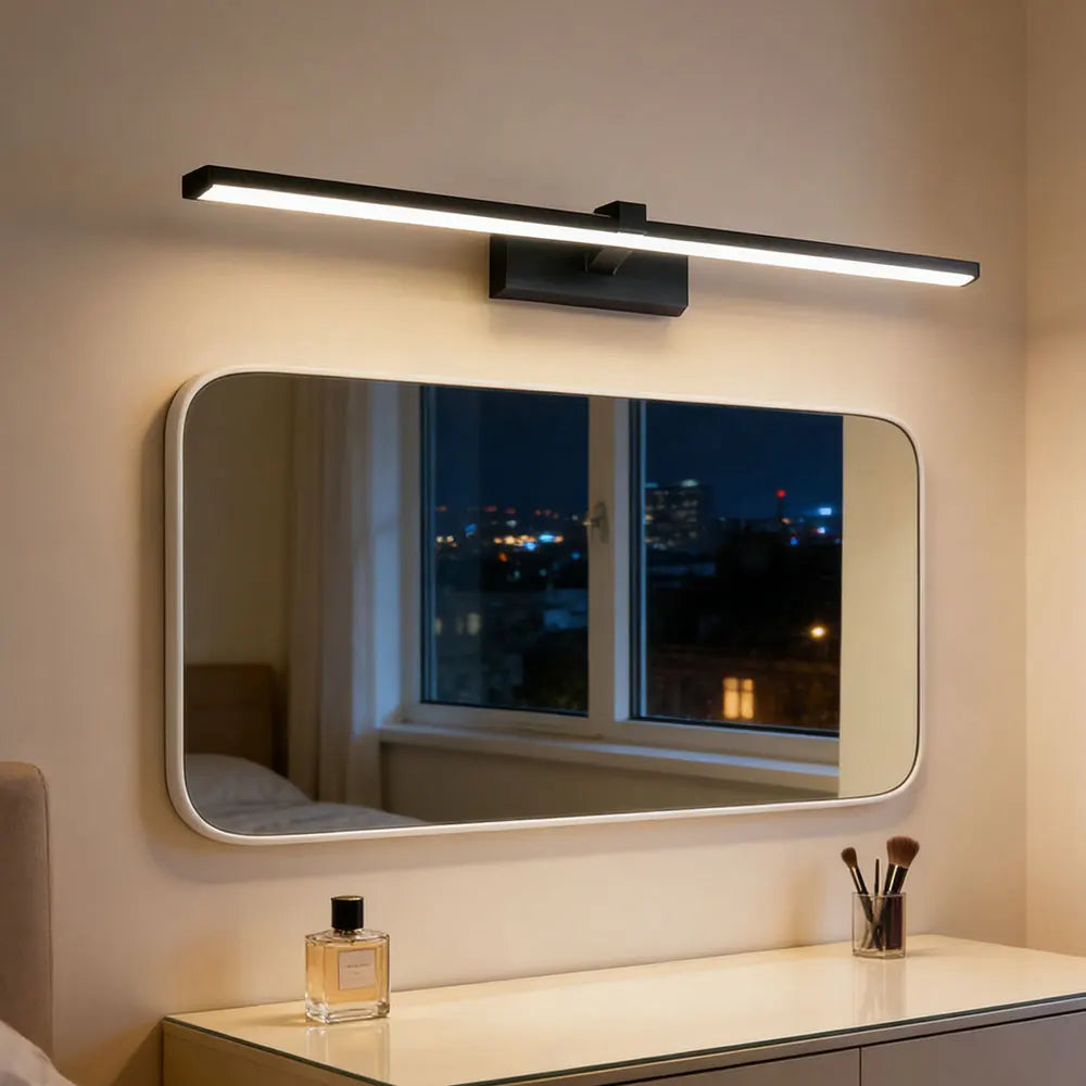 LED wall light above makeup vanity with mirror in bedroom setting
