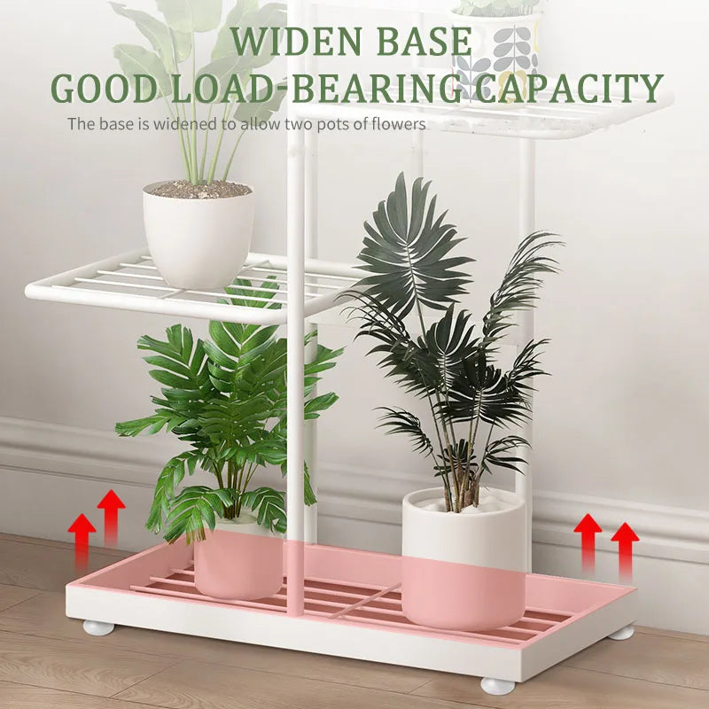 Close-up of widened white plant stand base holding potted plants on grid shelves