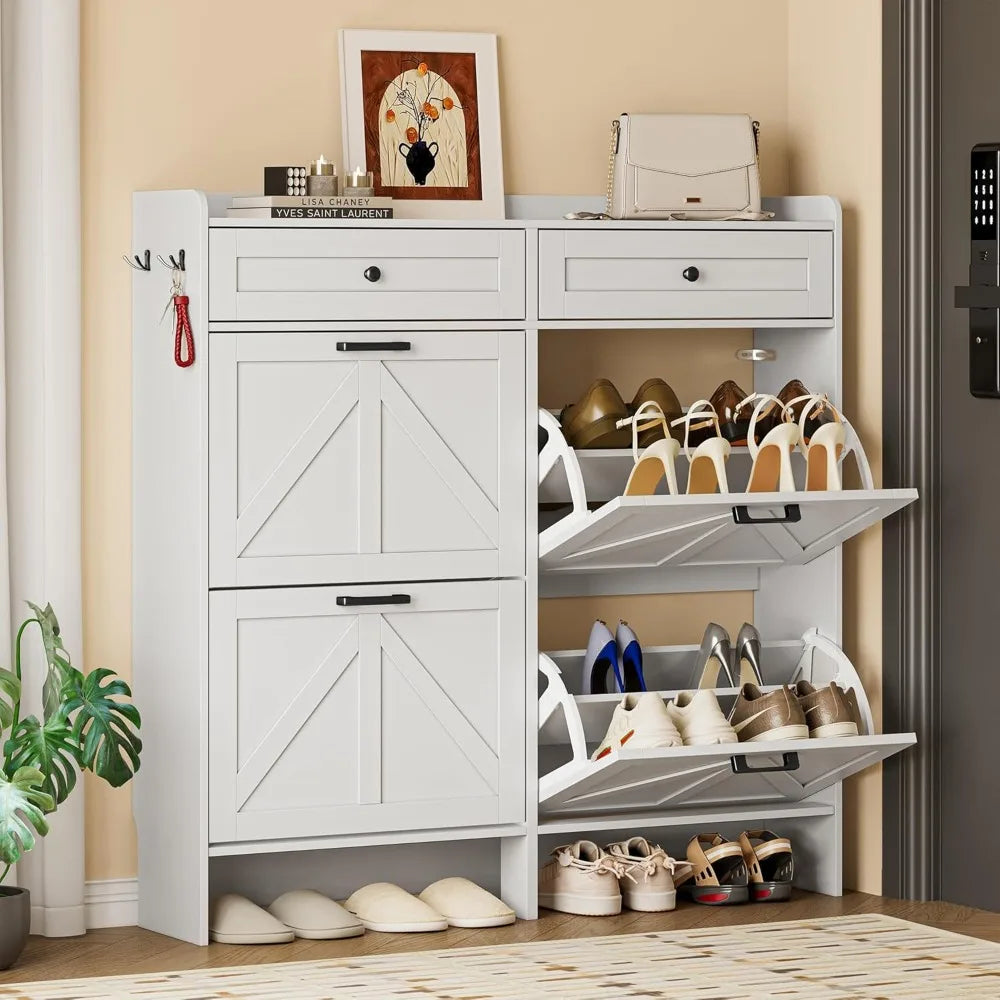 White shoe cabinet in entryway with flip drawers open, showing shoe storage organization