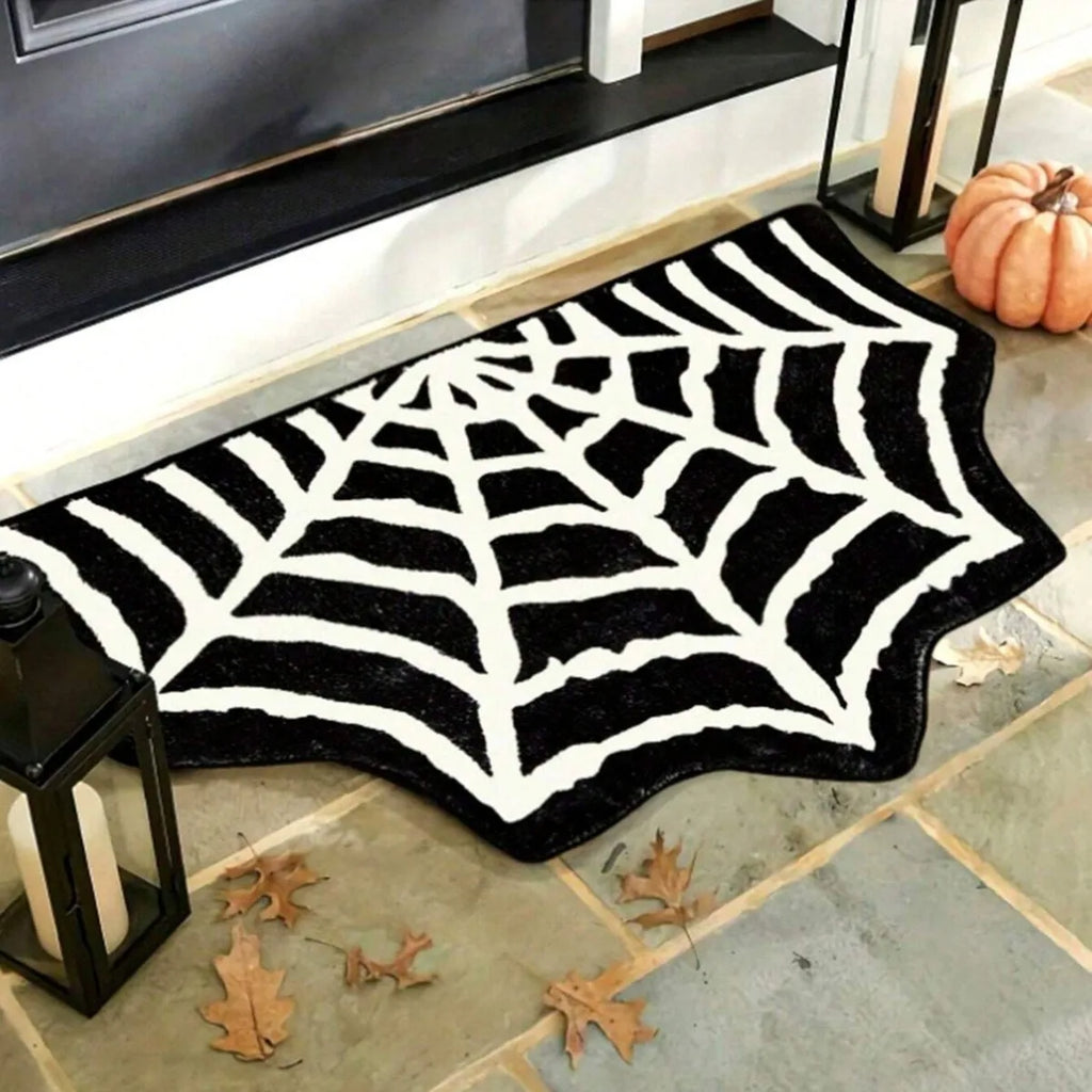 Spider web shaped rug with black and white design as a seasonal indoor entry mat