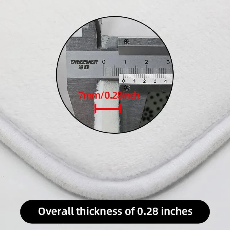 Detail of bath mat thickness measurement showing approximately 0.28 inches