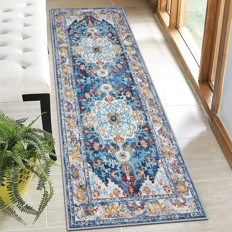 Colorful blue-gold boho runner rug placed in bright hallway by window