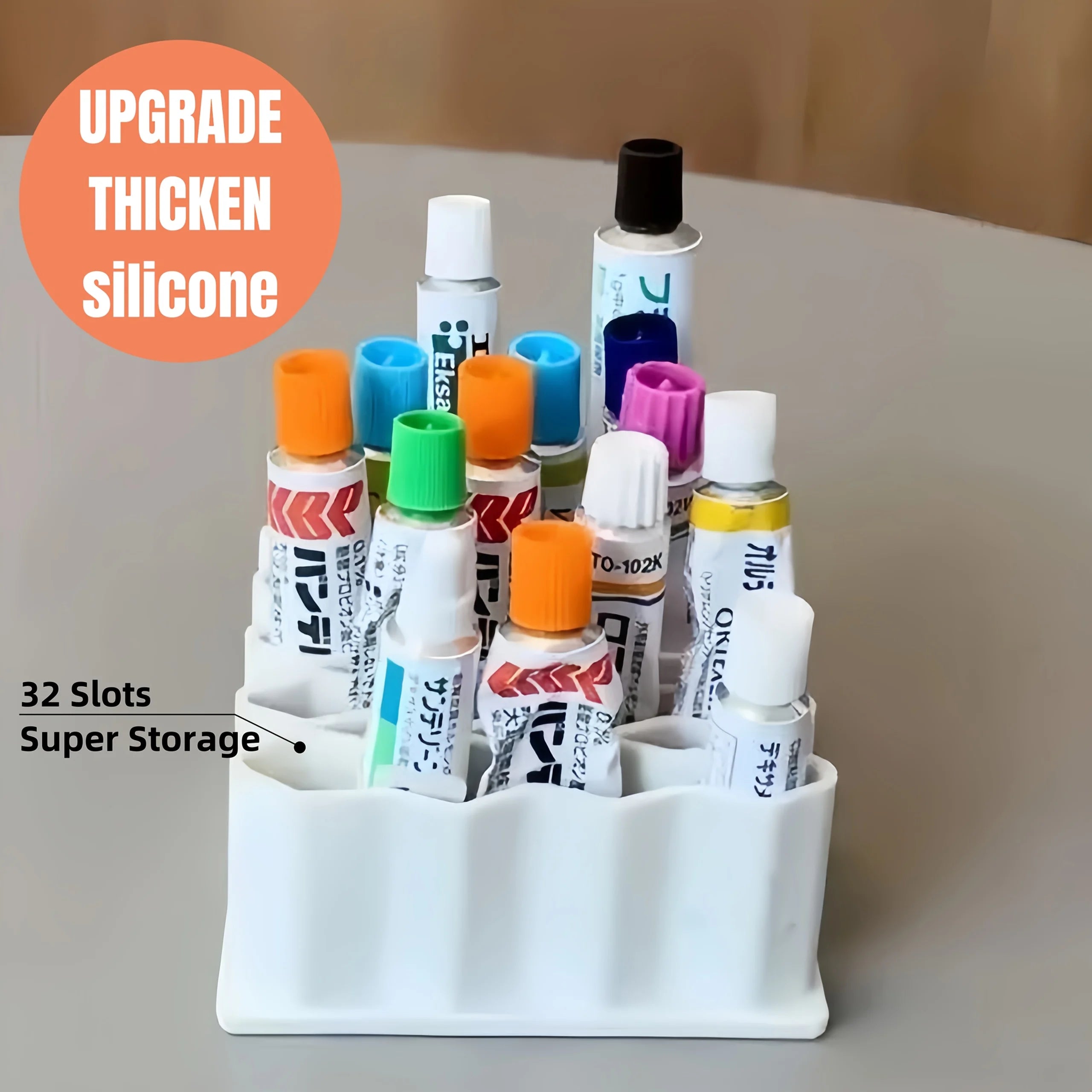 White 32-slot silicone ointment organizer holding small tubes upright on a table