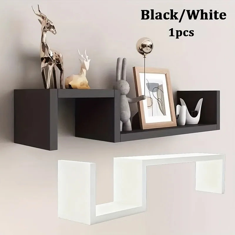 Close-up of black S-shaped wall shelf mounted on wall and alternate white shelf shown, Black/White color text visible