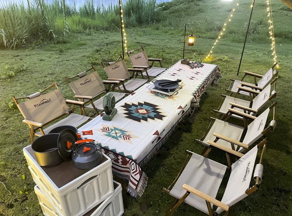 Oversized geometric fringe throw blanket used as a tablecloth for an outdoor picnic setup