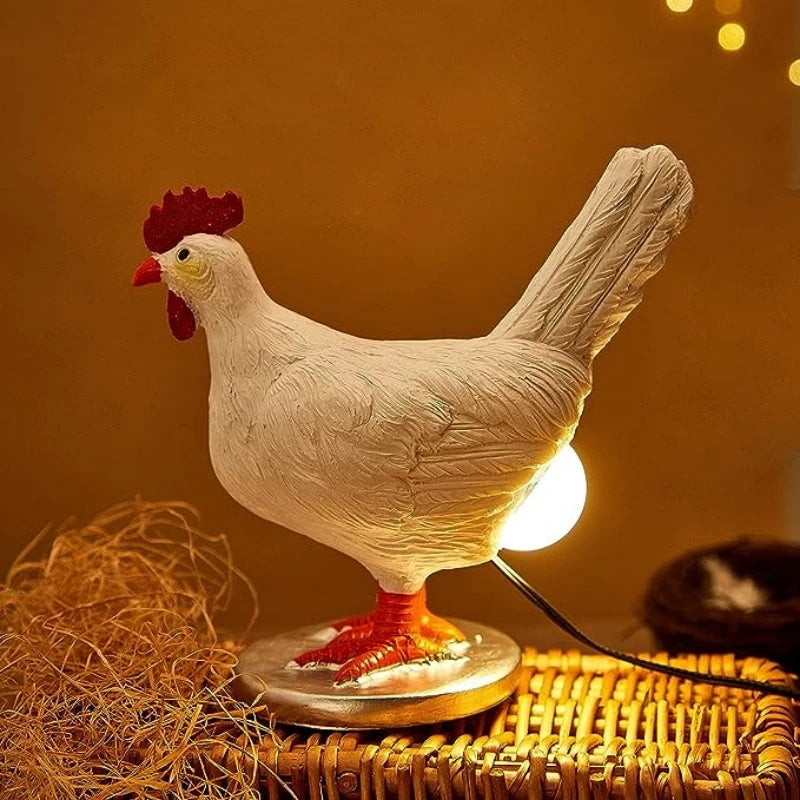 Resin chicken shaped table lamp glowing on a nightstand, with soft yellow background lighting