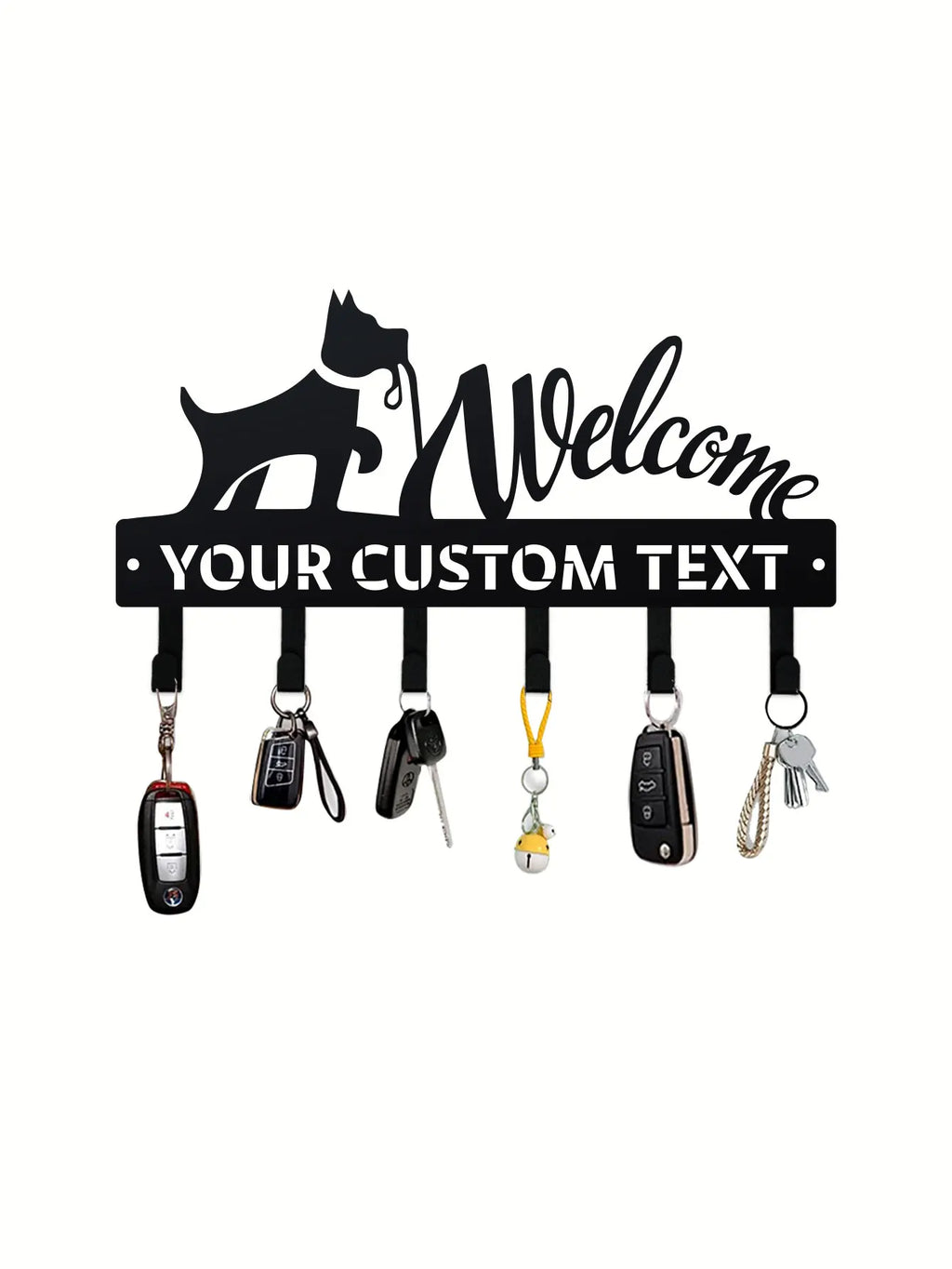 Close-up of custom black metal wall rack with dog motif and personalized text, holding several key sets