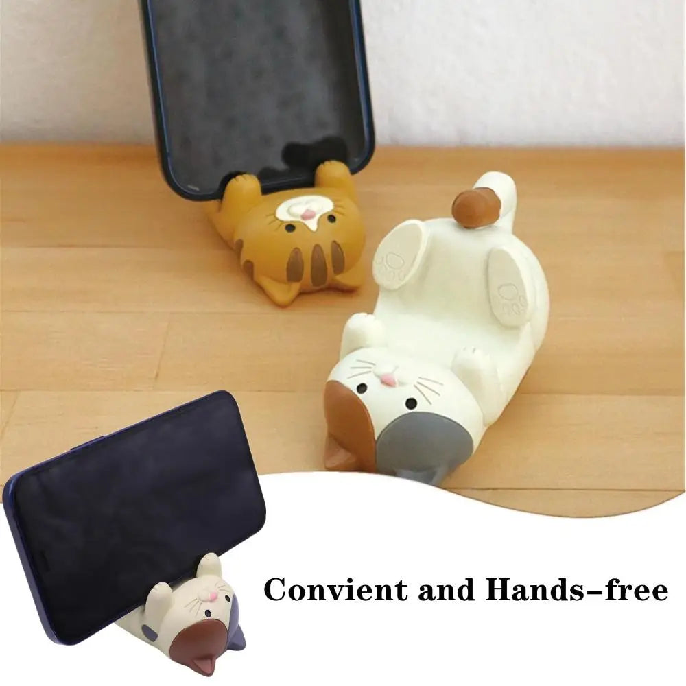 Cat phone holder in use, brown and white color options displayed, both holding smartphones upright