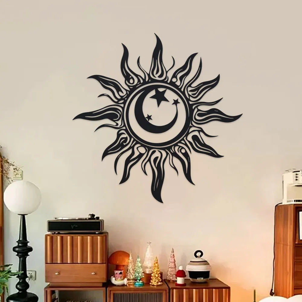 Black iron sun and moon wall art hanging above a media cabinet in a cozy living room