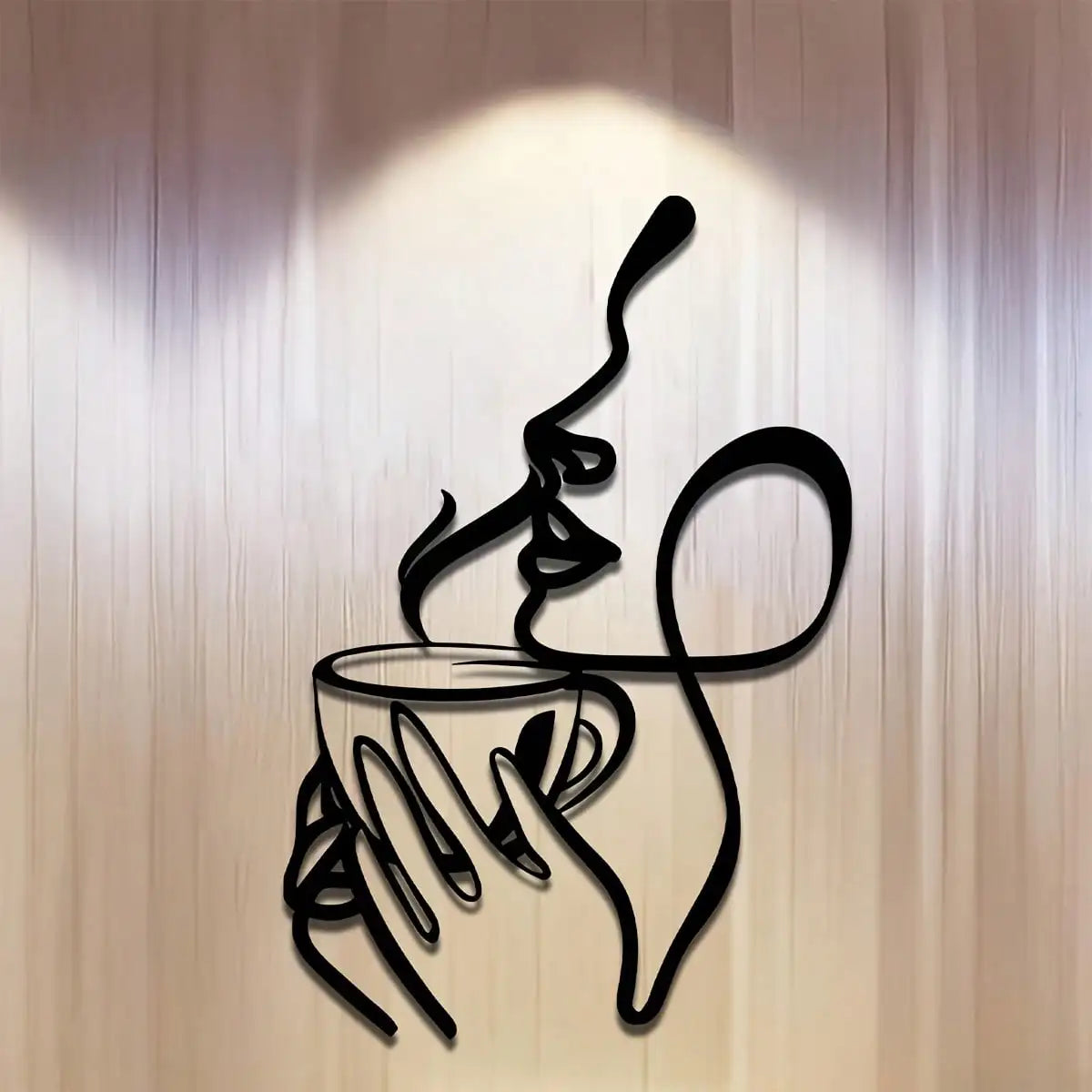 Minimalist metal wall art with woman sipping from a cup, shown mounted on a beige wall