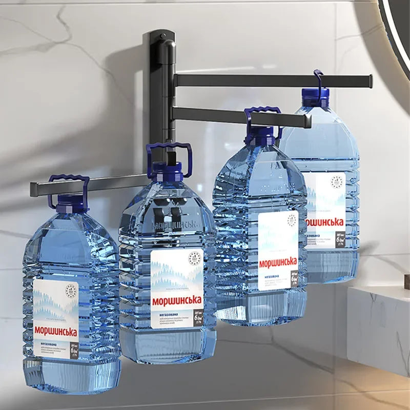 Black wall-mounted towel rack with rotating arms, each holding large blue water bottles to illustrate strength