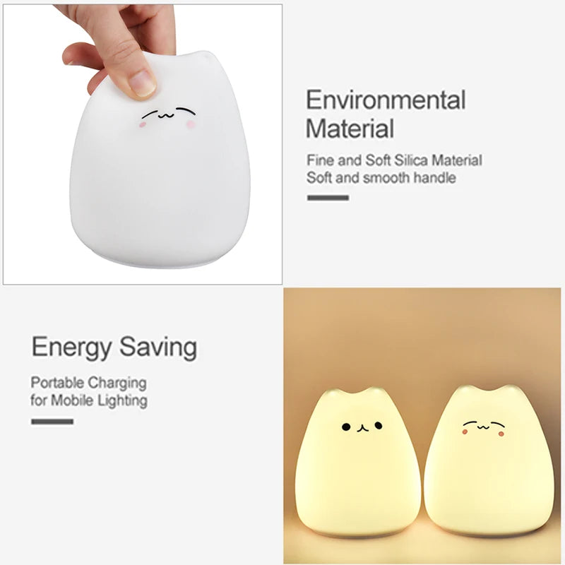 White silicone cat night light being squeezed and two cat night lights glowing on a tabletop