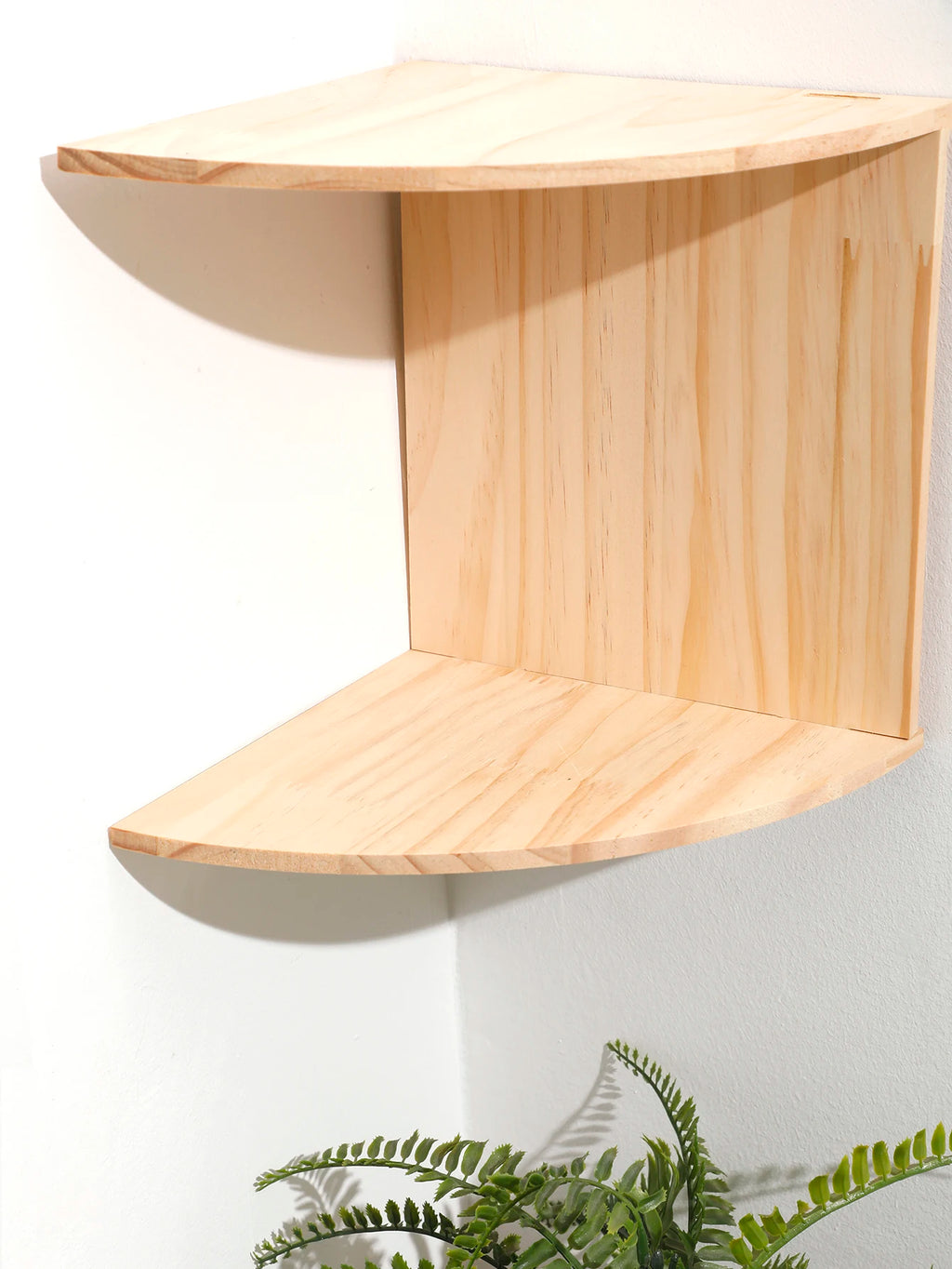 empty 2-tier burlywood wooden corner shelf shown in corner setting