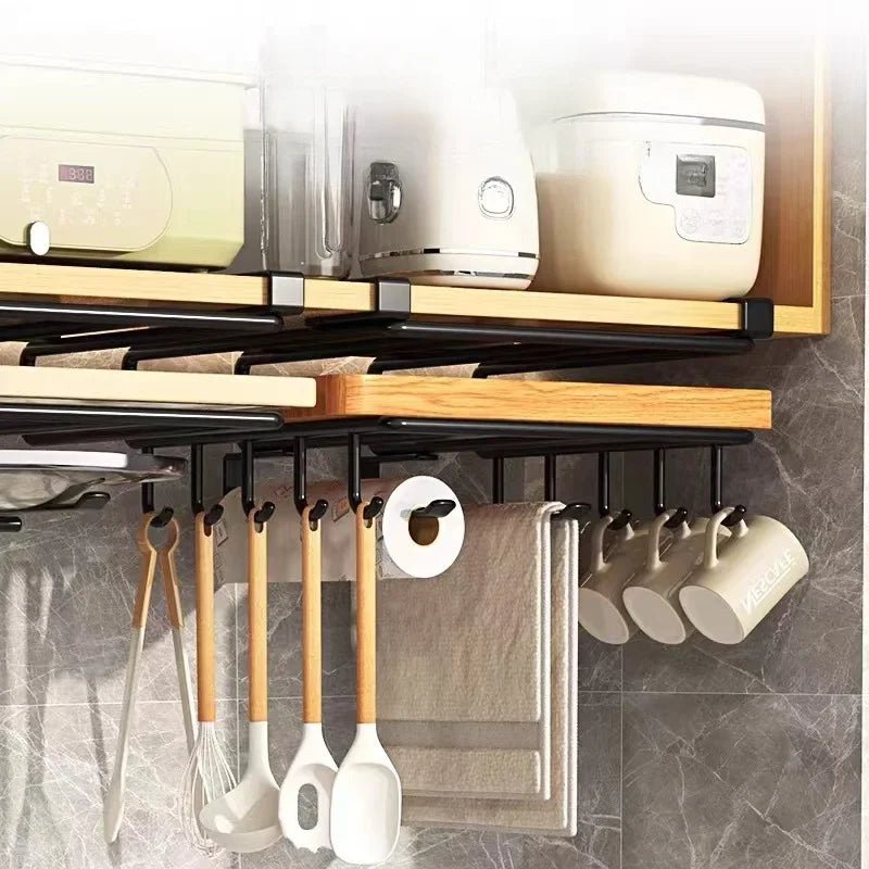Two racks mounted under kitchen cabinets, storing utensils, towels, and mugs