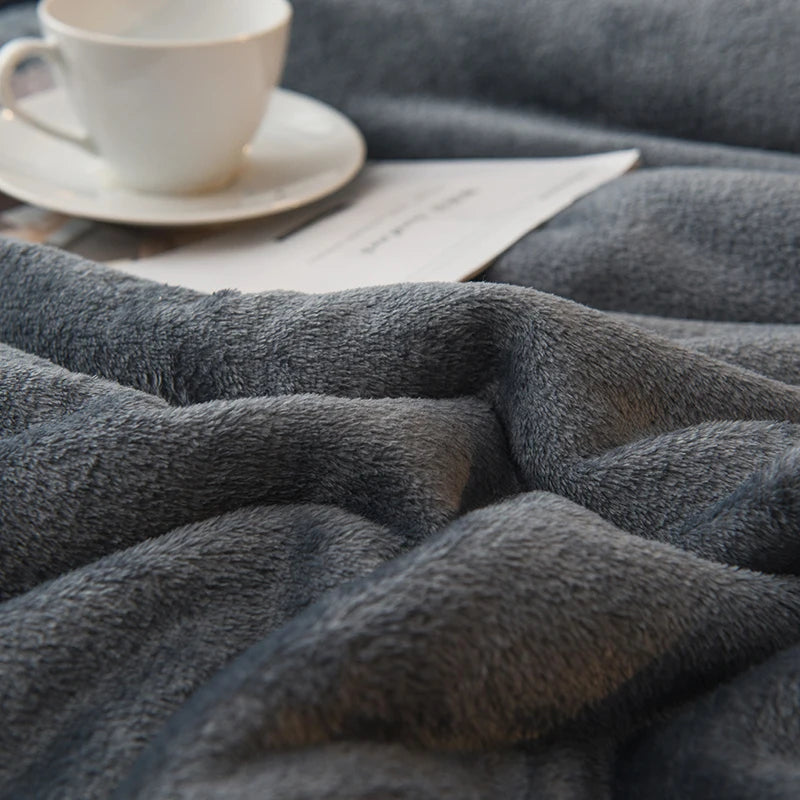 Close-up of plush fleece blanket fabric texture in a home setting