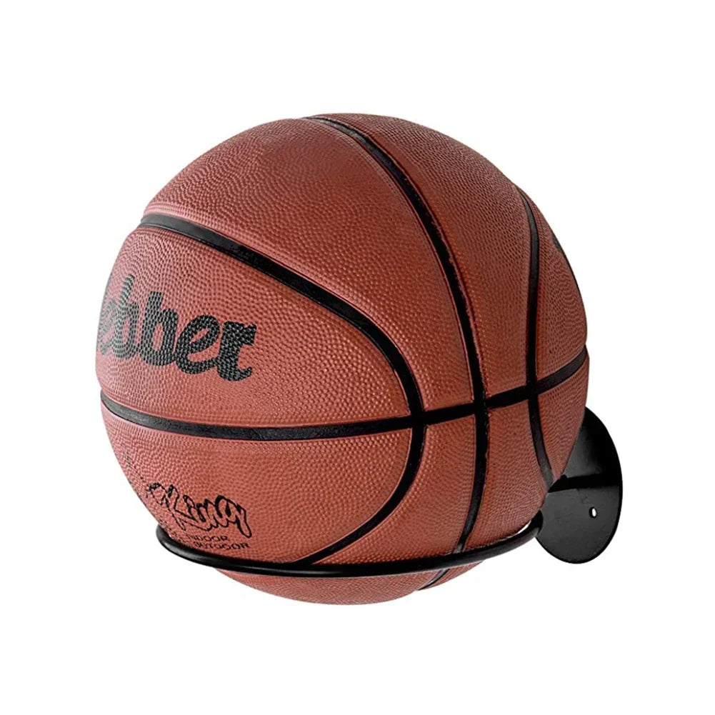Close-up of a basketball on a black metal wall-mounted ball rack