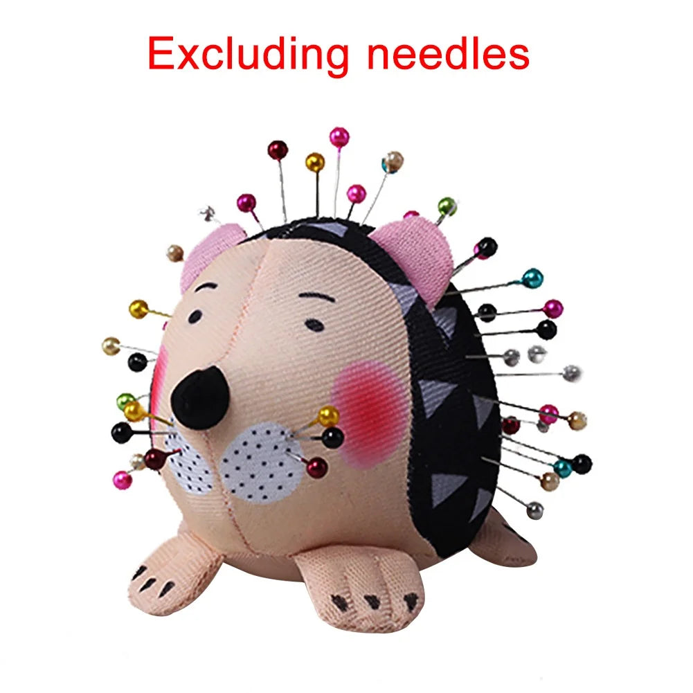 Hedgehog pin cushion shown with pins inserted, excluding needles text
