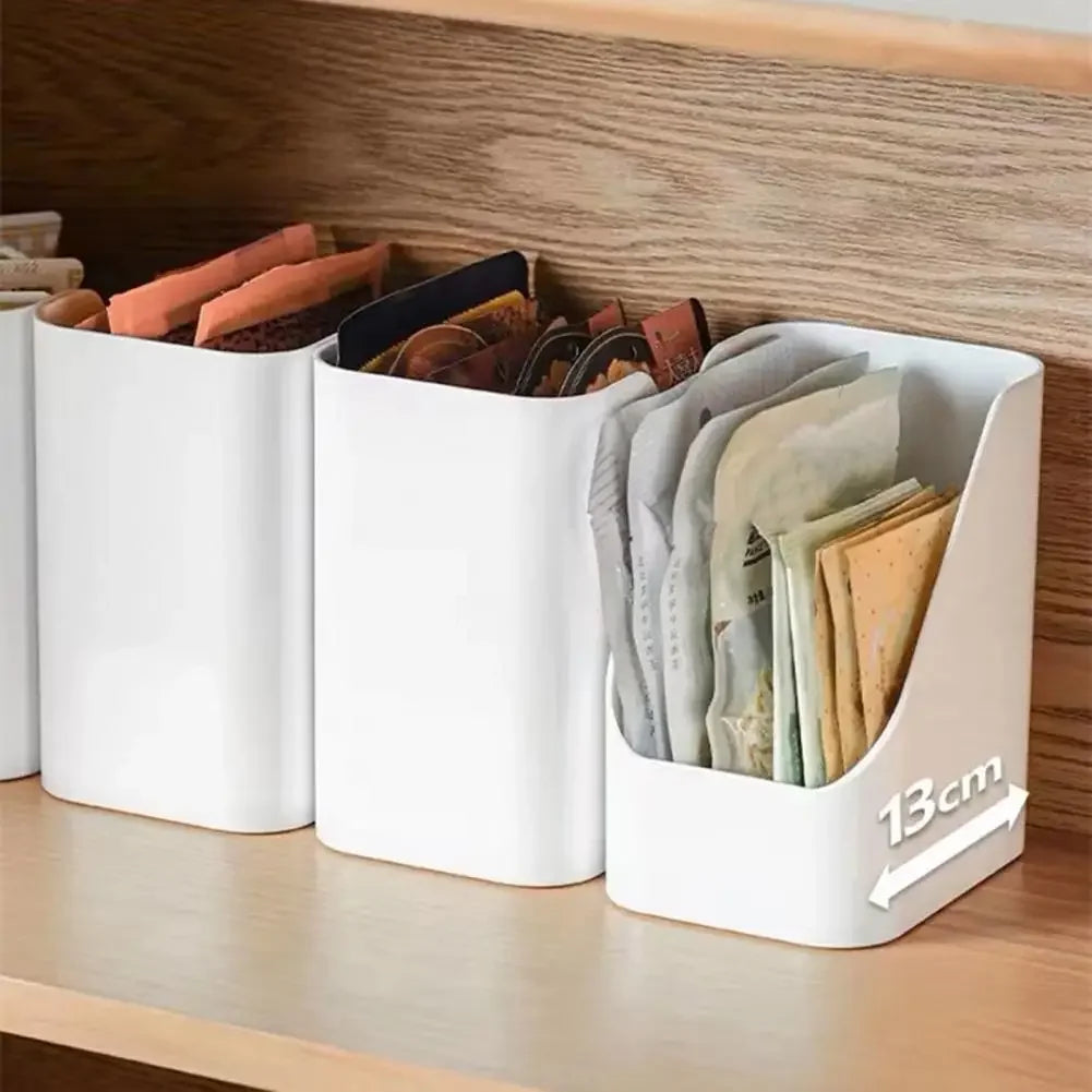 White organizer bin on a wooden pantry shelf holding tea or seasoning packets, showing 13cm width