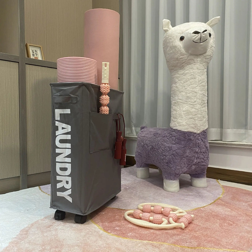slim gray laundry basket used for storing pink yoga gear in a playroom