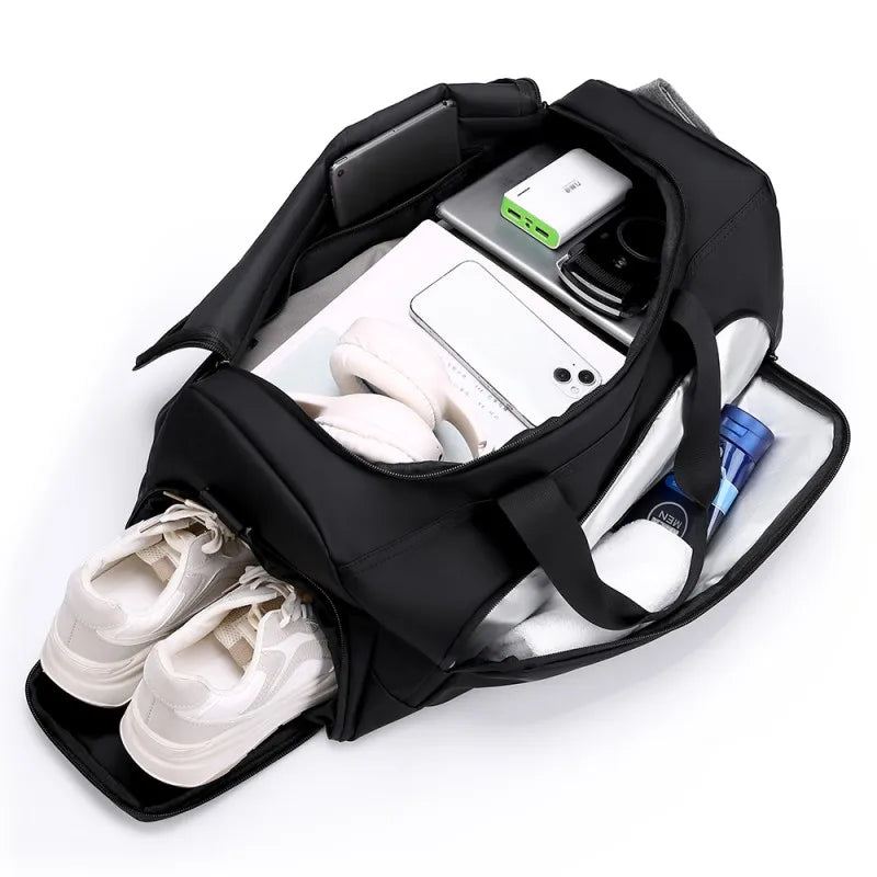 Open duffel bag packed with gym gear, clothing, shoes, and accessories