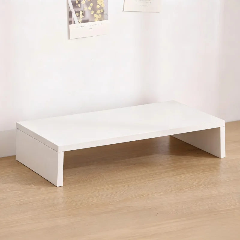 White U-shaped wooden monitor riser stand displayed on a light wood floor.