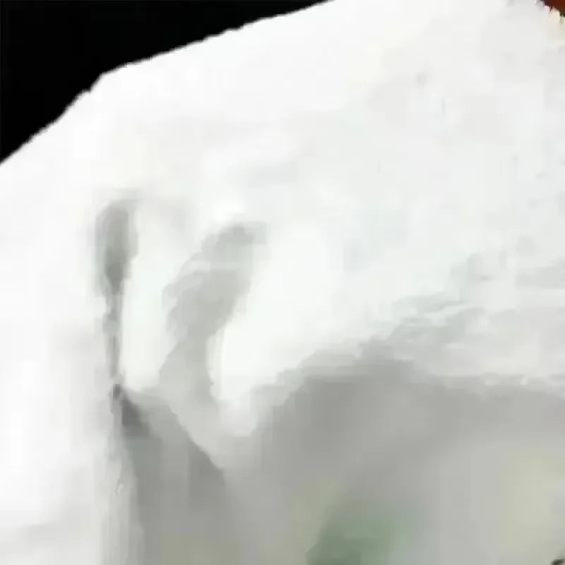 Close-up of the white sherpa fleece edge of the blanket