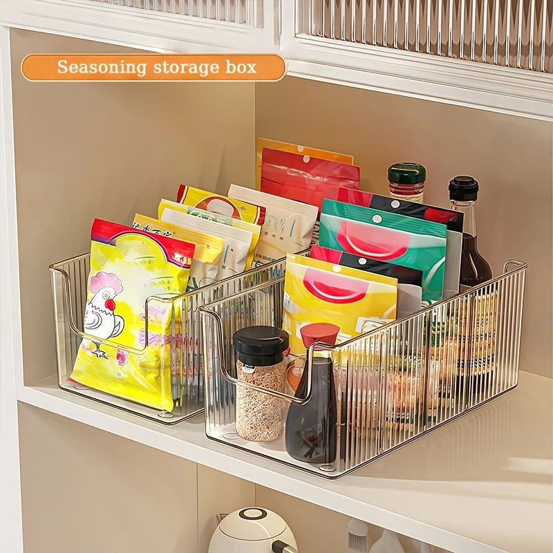 Seasoning packets and sauces neatly stored in clear ribbed organizer bins on a kitchen shelf