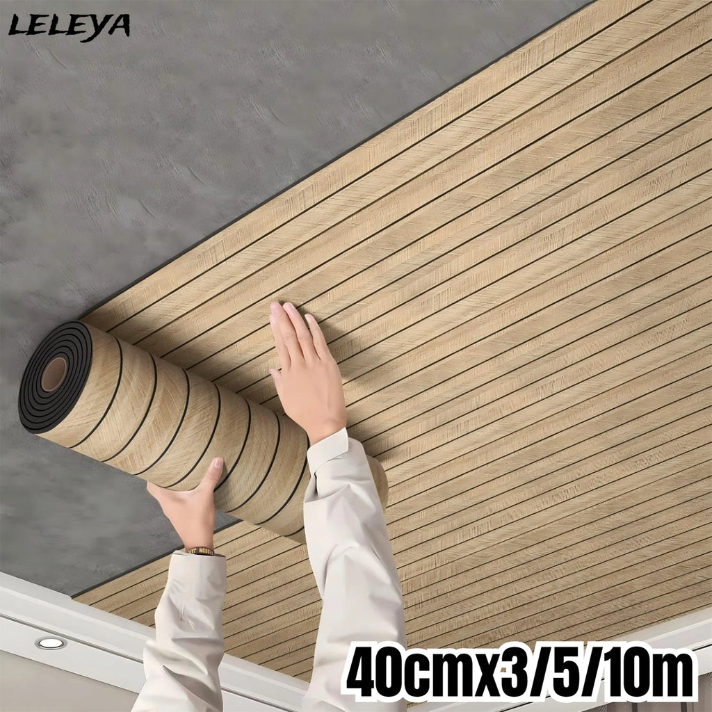 Hands applying wood grain slat wall panel roll to a ceiling