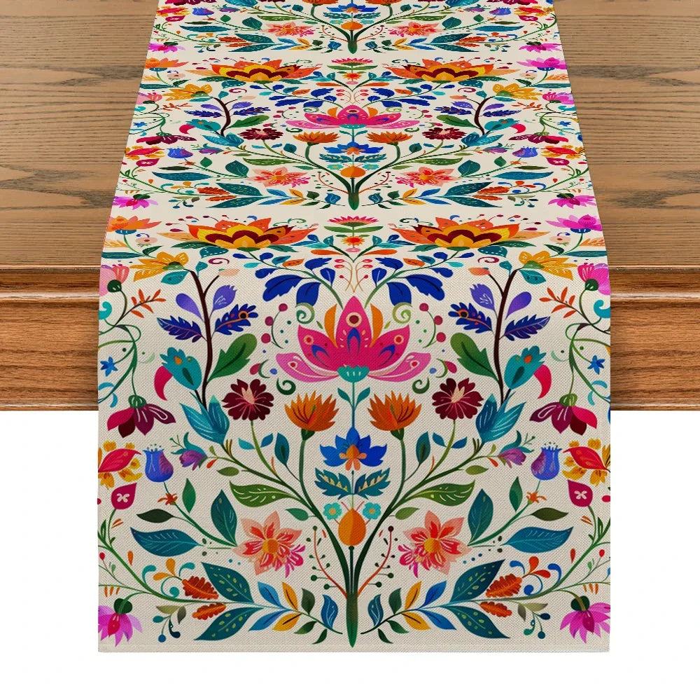 Sierra Flores colorful floral table runner with bright folk art print on a wooden dining table