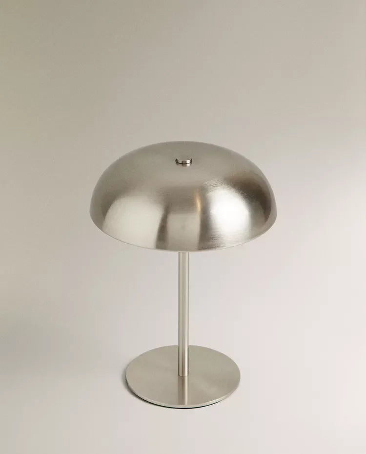 Rechargeable touch table lamp in silver finish on neutral background