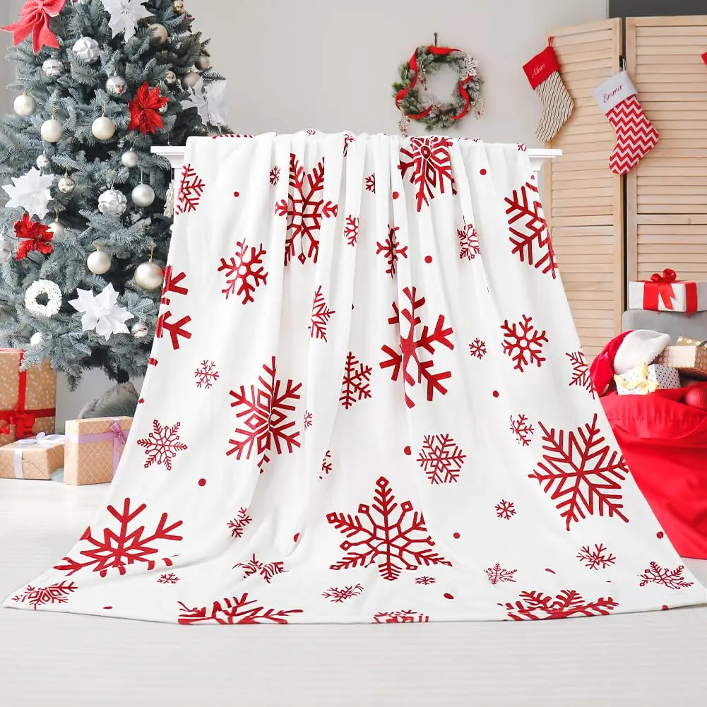 Snowflake flannel blanket on drying rack in a holiday-decorated living room