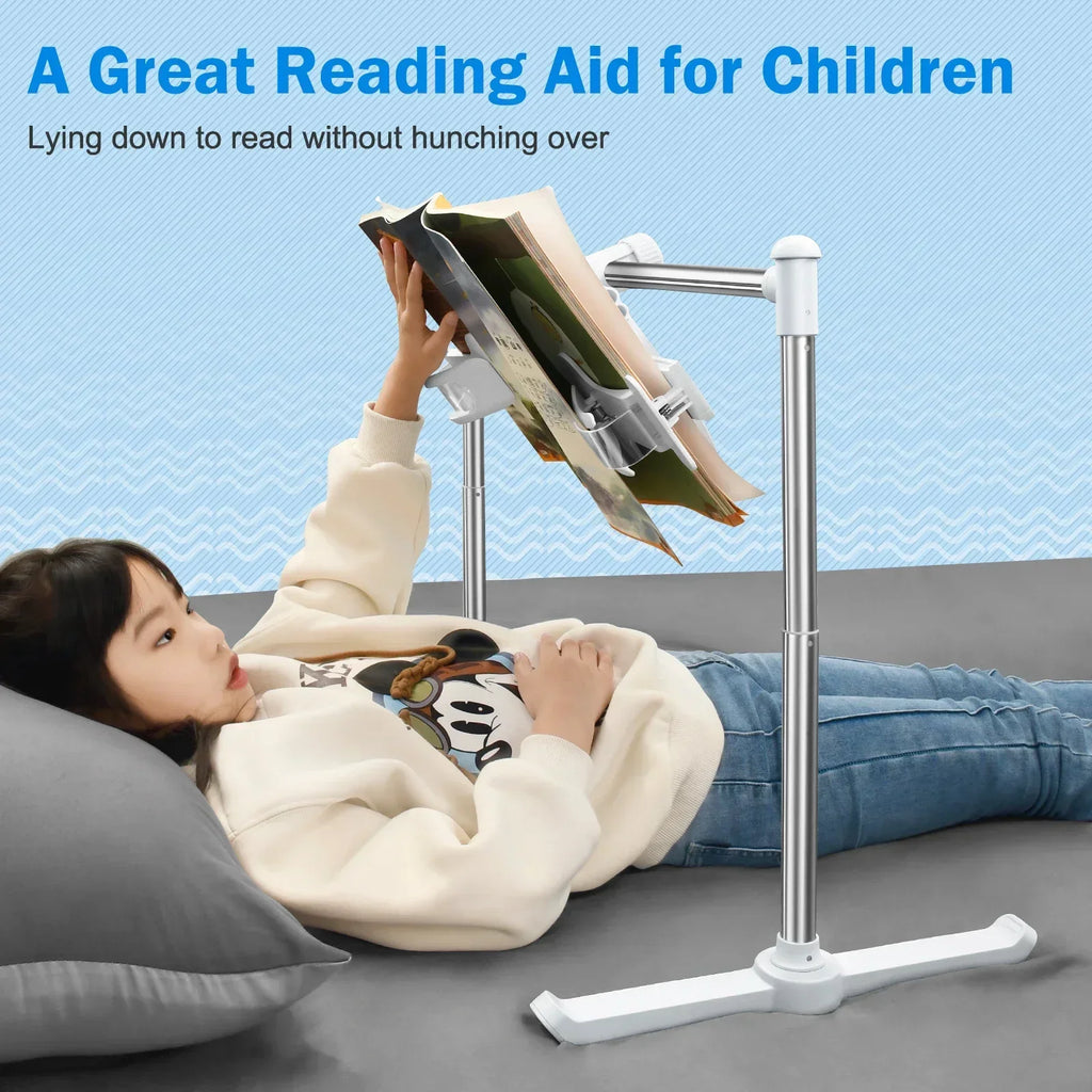 Child using the book stand for reading while lying on the floor