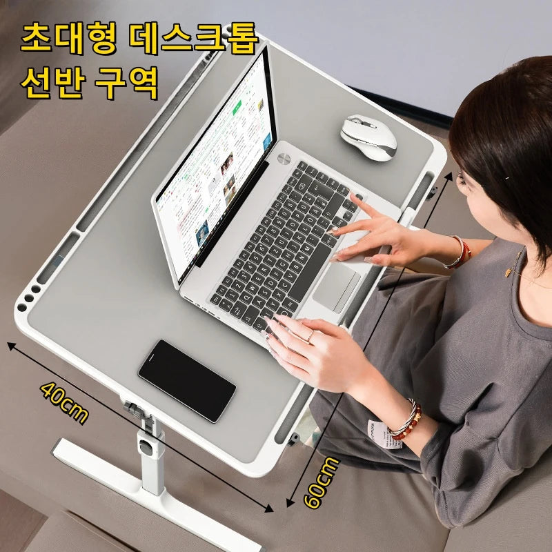 Person using a foldable laptop tray table on a sofa with a laptop and phone, showing table dimensions