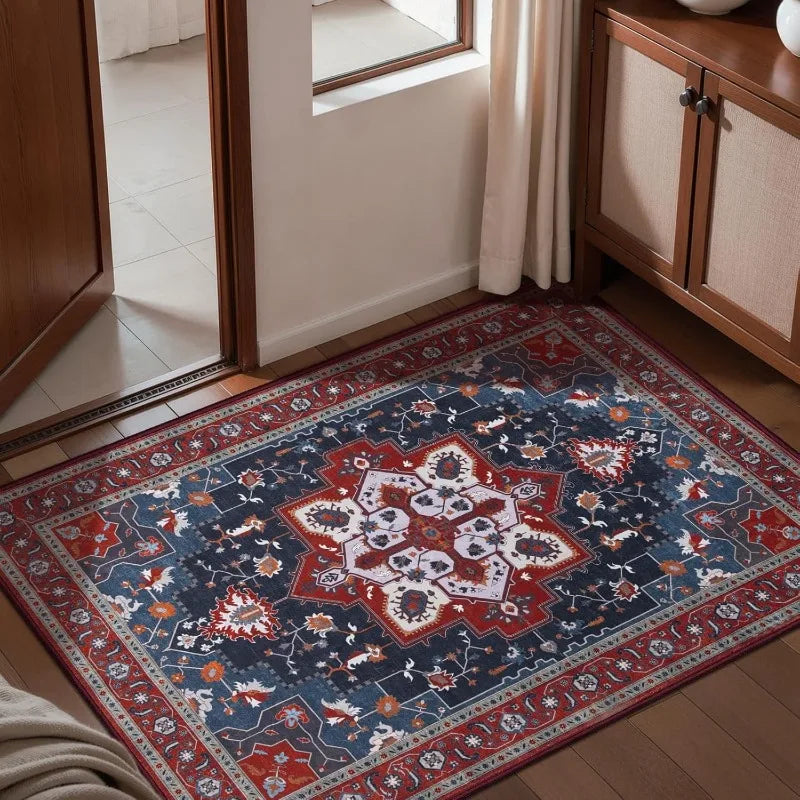 deep red and blue Persian floral patterned doormat in an indoor entryway