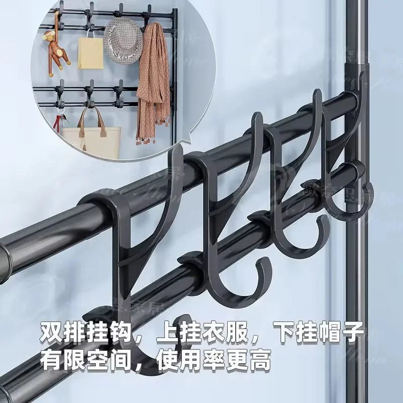 Closeup of black double hooks on a metal entryway rack for hanging coats, hats, and scarves