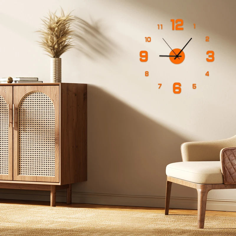 Orange-red frameless wall clock above a mid-century cabinet and neutral armchair
