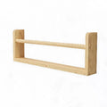 Single floating wooden wall shelf with an open ledge design viewed against a plain background.