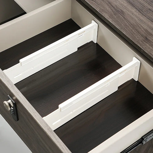 Two white adjustable ABS drawer dividers shown in an empty drawer