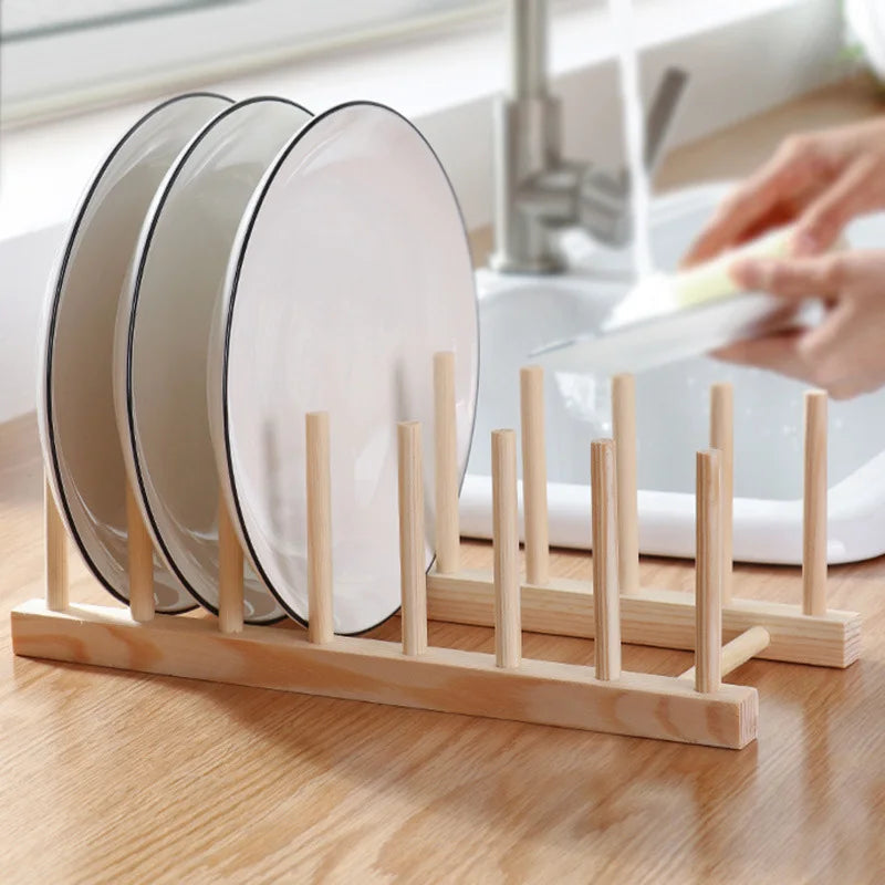 Wooden rack used to organize plates by the kitchen sink