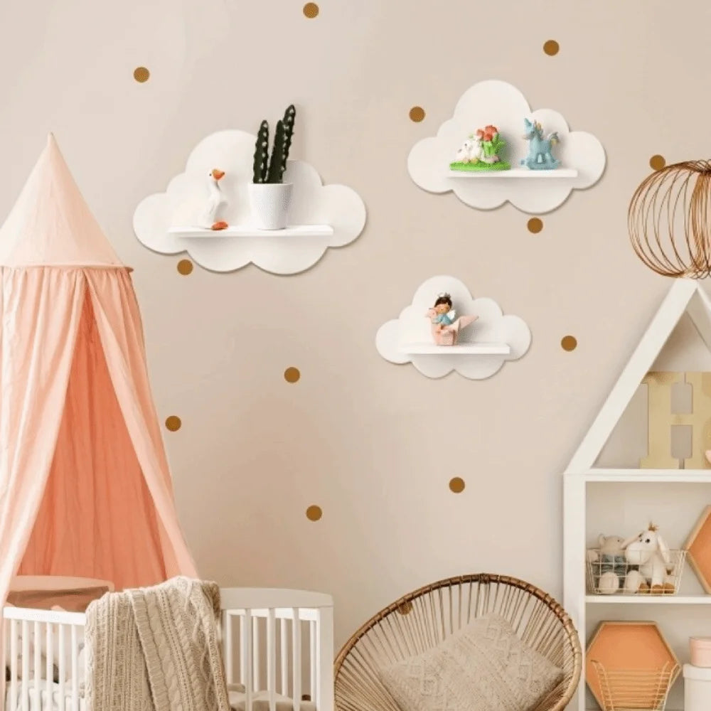 Cloud-shaped wall shelves in a nursery, styled with plants and small toys