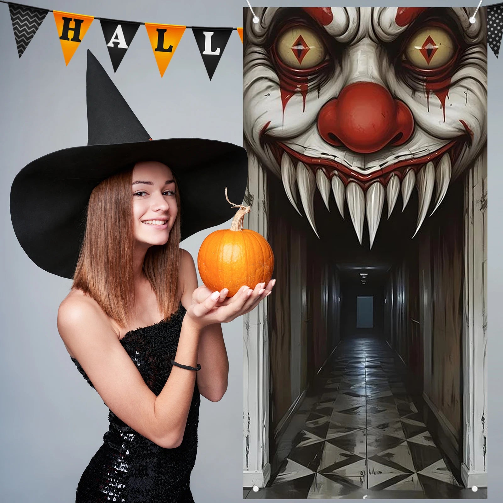 Woman dressed as a witch holding a pumpkin next to the clown door cover backdrop